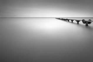 Abandoned, an empty old pier in a lake on a foggy day - NiO Photography