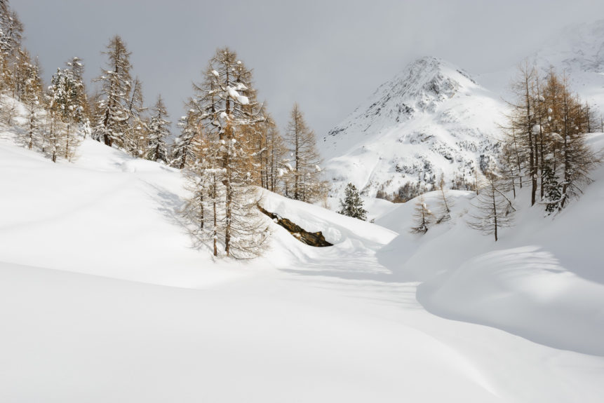 A Swiss winter landscape with a fresh coat of snow, featuring Lac Bleu and the Grande Dent de Veisivi mountain in Arolla, Switzerland. Frosty - Copyright Johan Peijnenburg - NiO Photography