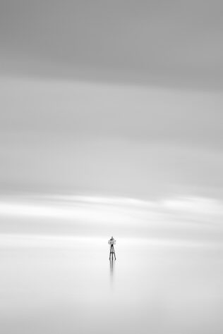 Two birds overlooking a calm Norwegian Sea near Lofoten from a small lighthouse, in a dreamy and soothing minimalist coastal landscape in black & white. Soothing - Copyright Johan Peijnenburg - NiO Photography