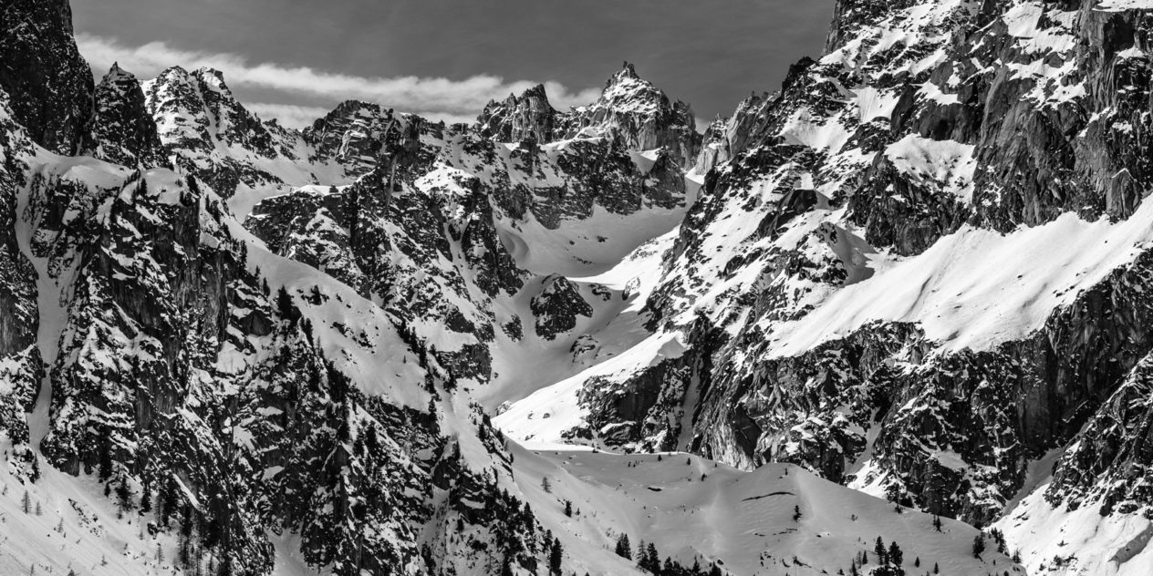 Winter close-up of various snow-covered peaks in the Mont Blanc Massif, as seen from Orsières in Switzerland. The view includes the Grand Darray, Le Portalet and the Pointe des Plines mountains. High alpine winter in black & white - Copyright Johan Peijnenburg - NiO Photography