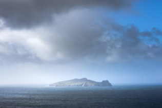 An Irish coastal landscape, showing the Blasket Islands getting closed in by heavy rain in the North Atlantic ocean near Dingle. Mystical - Copyright Johan Peijnenburg - NiO Photography