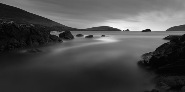 An Irish coast landscape in B&W, showing the rugged Irish coastline and the Blasket Islands near Dingle, in Kerry, Ireland. The Getaway - Copyright Johan Peijnenburg - NiO Photography