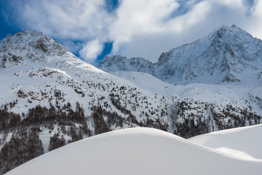 A winter mountain landscape, showing the beauty of the Swiss Alps Dent de Perroc and Grande Dent de Veisivi near Evolène in Valais with snow. Winter Wonderland - Copyright Johan Peijnenburg - NiO Photography